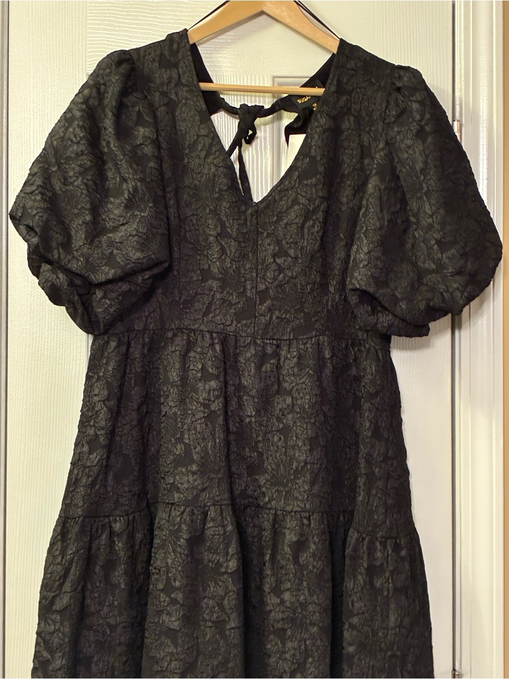 Solid Black Floral 1X Midi Dress with Short Puff Sleeves Flounce Hem V-neckline.
